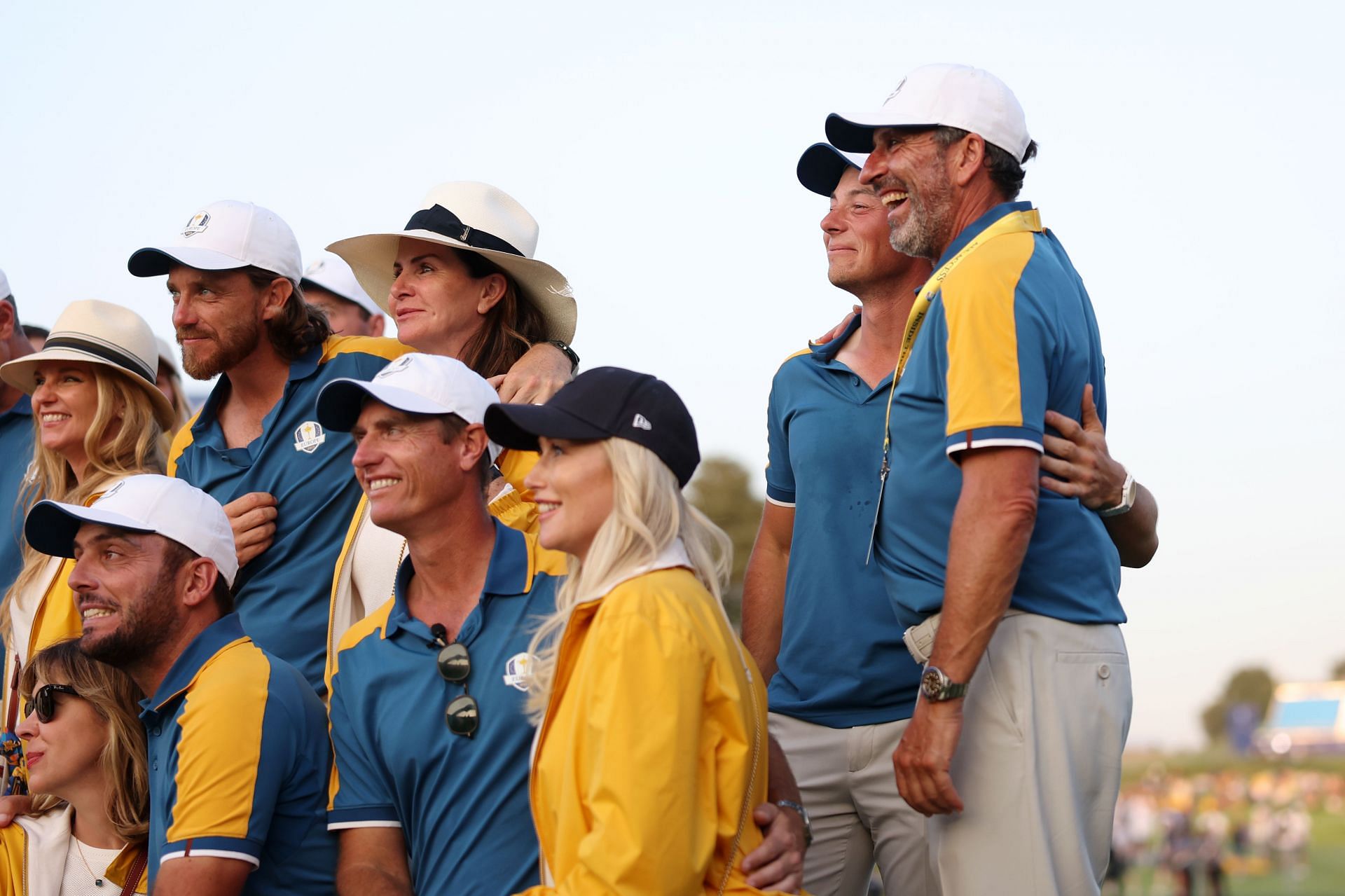 Team Europe pose for a picture with their partners as Viktor Hovland, the only single member of the team stands on the side during the Sunday singles matches of the 2023 Ryder Cup. Source: Getty
